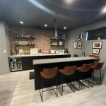 photo of the bar area in the Hofsted basement, designed and built by KMA Building in Winnipeg, MB