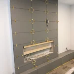 photo of the fireplace in the "Barker" feature wall designed and built by KMA Building in Winnipeg, MB