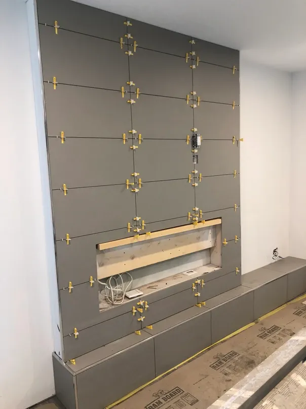 photo of the fireplace in the "Barker" feature wall designed and built by KMA Building in Winnipeg, MB