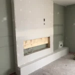 photo of the fireplace in the "Barker" feature wall designed and built by KMA Building in Winnipeg, MB