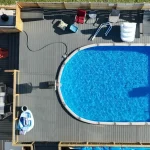 photo of the "Heloise" deck, a composite swimming pool deck designed and built by KMA Building in Winnipeg, MB