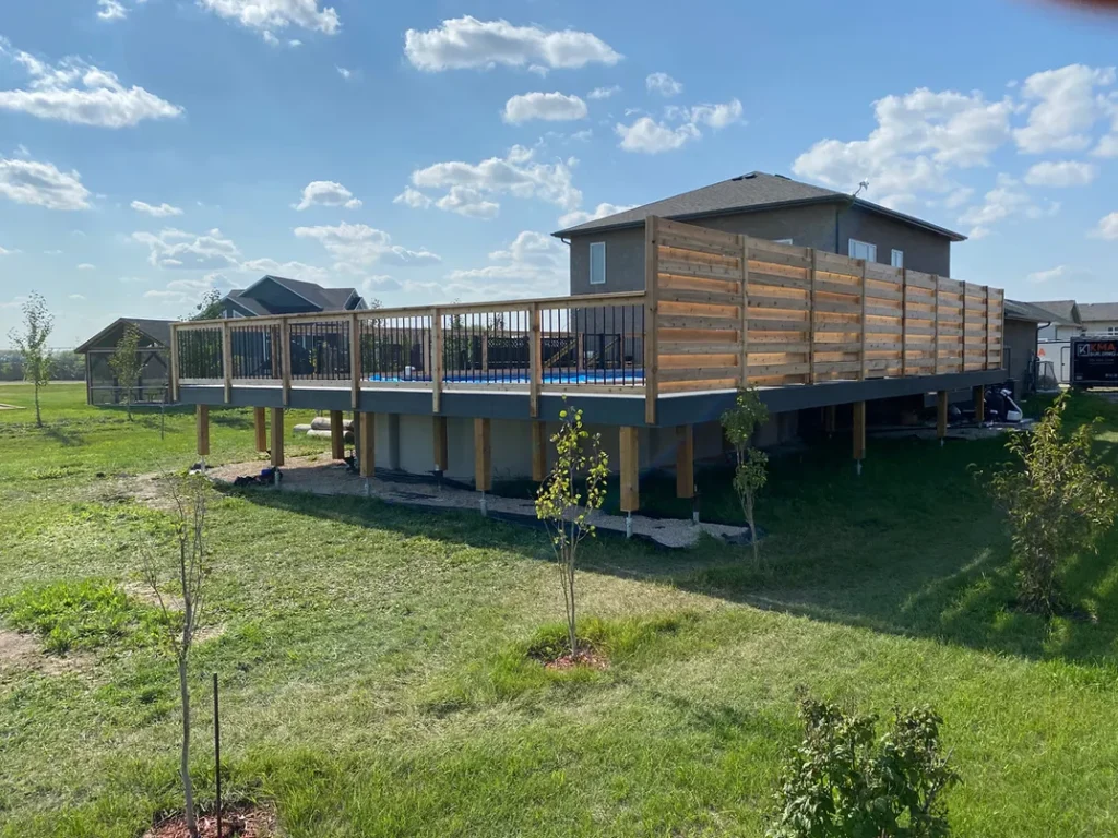 photo of the "Heloise" deck, a composite deck designed and built by KMA Building in Winnipeg, MB