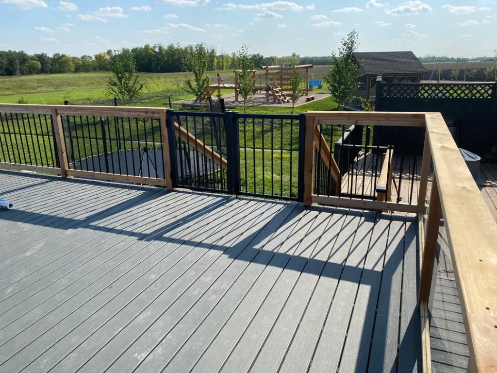photo of the "Heloise" deck, a composite deck designed and built by KMA Building in Winnipeg, MB