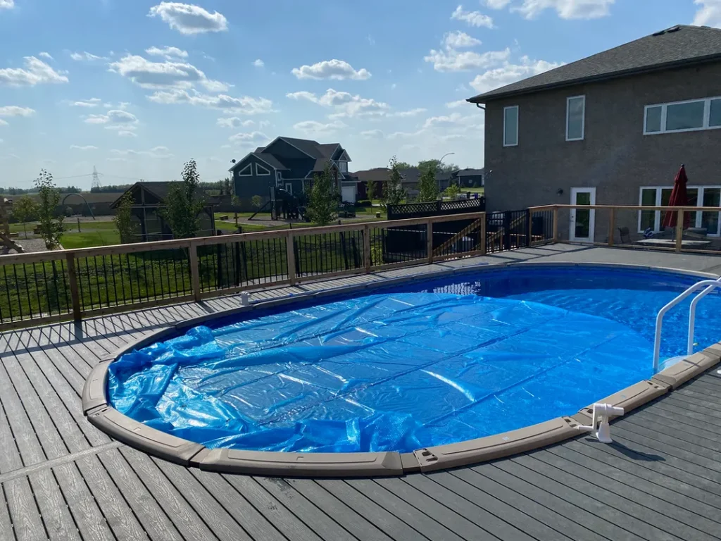 photo of the "Heloise" deck, a composite swimming pool deck designed and built by KMA Building in Winnipeg, MB