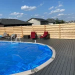 photo of the "Heloise" deck, a composite swimming pool deck designed and built by KMA Building in Winnipeg, MB