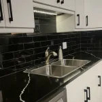 photo of the sink in the "Main" kitchen designed and built by KMA Building in Winnipeg, MB