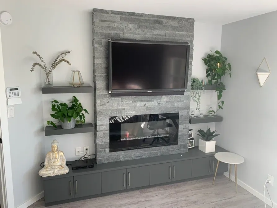 photo of the fireplace in the "Oaklawn" feature wall designed and built by KMA Building in Winnipeg, MB
